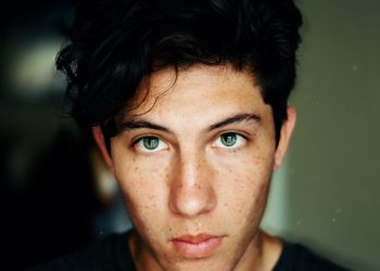 man wearing black crew-neck shirt